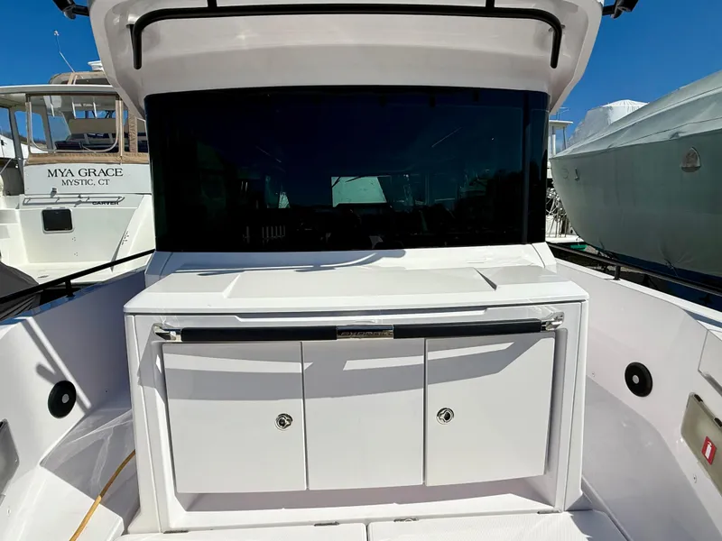 Slide: The Image of 2021 Axopar 37 boat with sleek design and spacious deck area. - 12