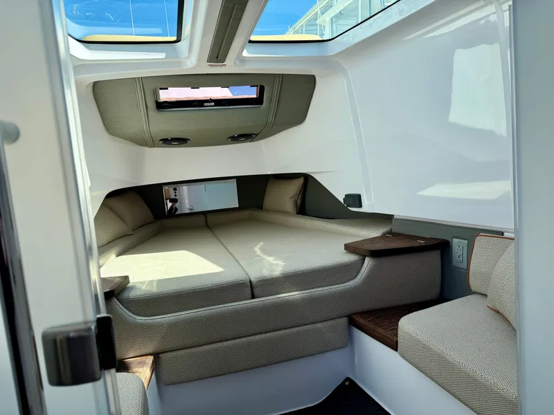 Slide: The Image of Interior cabin of 2021 Axopar 37 boat with comfortable seating and modern design. - 26