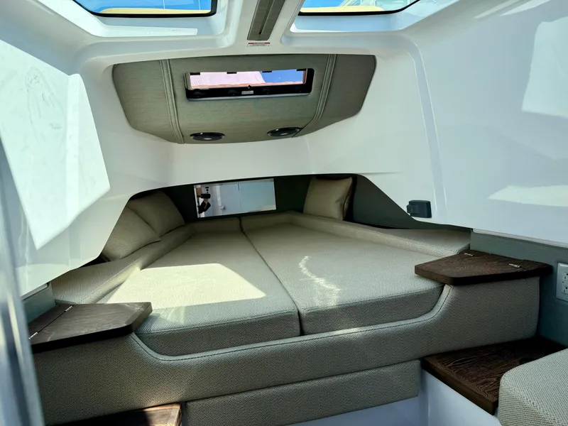 Slide: The Image of Interior cabin of 2021 Axopar 37 boat with comfortable bedding and modern design. - 27
