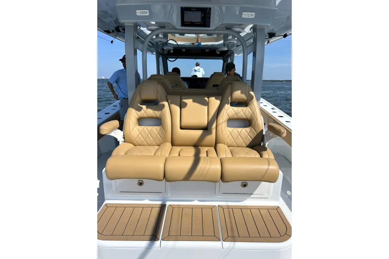 Slide: The Image of Luxurious seating on a 2026 Freeman 47 boat, featuring tan leather upholstery. - 12