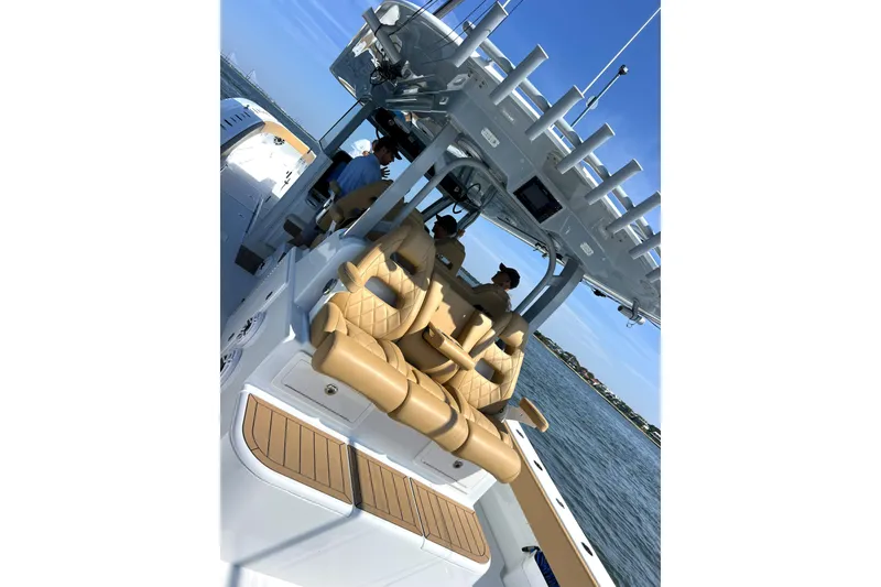 Slide: The Image of 2026 Freeman 47 boat interior with tan seats and ocean view. - 13