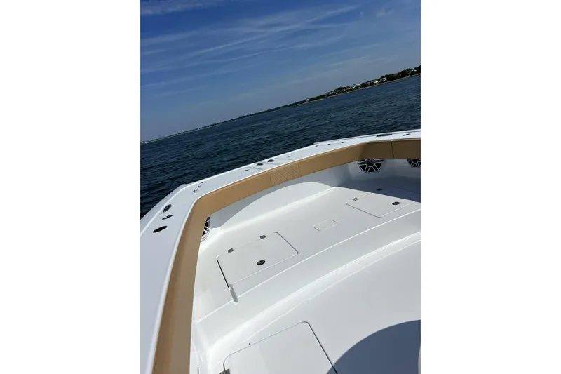 Slide: The Image of Freeman 47 boat, 2026 model, cruising on open water under clear skies. - 6