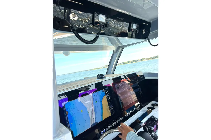 Slide: The Image of Cockpit view of 2026 Freeman 47 boat with advanced navigation displays. - 9