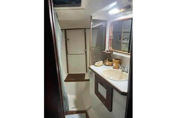 Slide: The Image of Bathroom interior of 1989 Catalina 42 sailboat with sink and shower. - 21