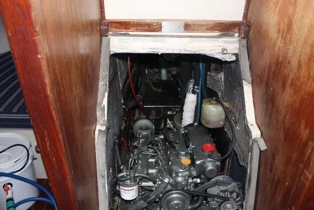 Slide: The Image of Engine compartment of a 1989 Catalina 42 sailboat, showcasing mechanical components. - 42