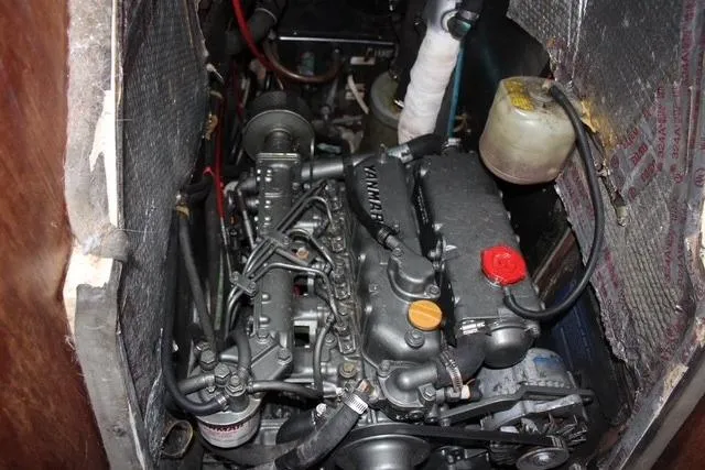 Slide: The Image of Engine compartment of a 1989 Catalina 42 sailboat, featuring a Yanmar marine engine. - 45
