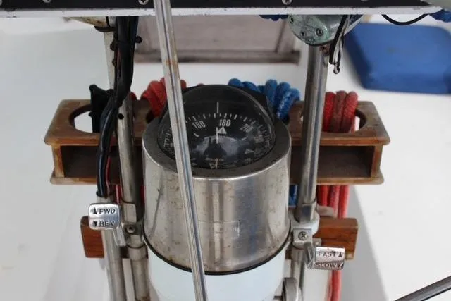 Slide: The Image of Compass and controls on a 1989 Catalina 42 sailboat cockpit. - 51