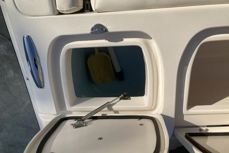 Slide: The Image of Open storage compartment on a 2015 Grady-White Freedom 275 boat. - 13