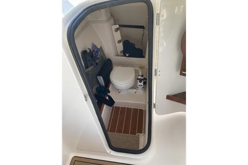 Slide: The Image of Interior view of 2015 Grady-White Freedom 275 boat's compact bathroom. - 15