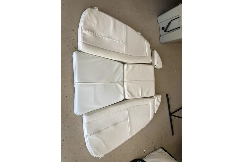 Slide: The Image of White boat cushions for 2015 Grady-White Freedom 275, displayed on a speckled floor. - 20