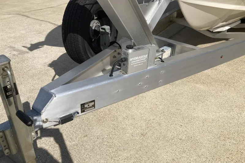 Slide: The Image of Trailer hitch of a 2015 Grady-White Freedom 275 boat on concrete surface. - 25