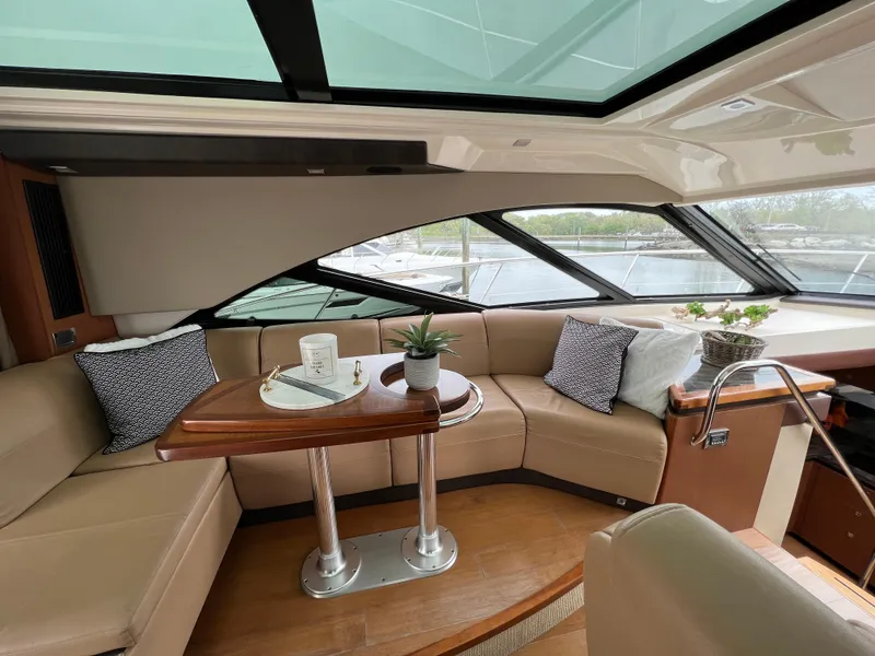 Slide: The Image of Luxurious interior of 2014 Sea Ray 510 Sundancer yacht with plush seating and elegant decor. - 11