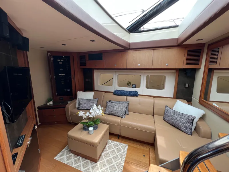 Slide: The Image of Luxurious interior of 2014 Sea Ray 510 Sundancer yacht with plush seating and modern decor. - 12