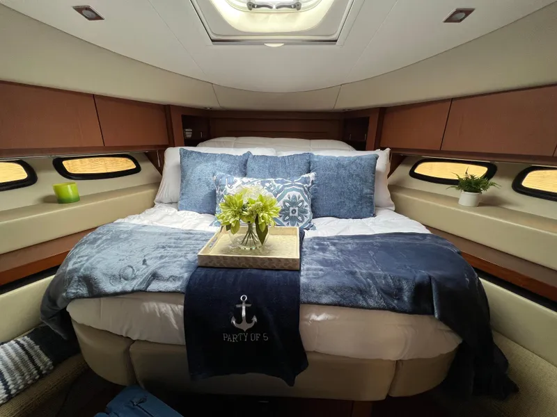 Slide: The Image of Luxurious 2014 Sea Ray 510 Sundancer cabin with elegant bedding and decor. - 15