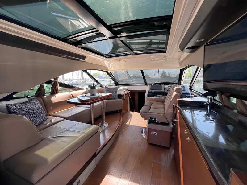 Slide: The Image of Luxurious interior of 2014 Sea Ray 510 Sundancer yacht with leather seating and modern amenities. - 19