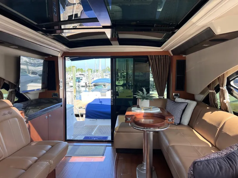 Slide: The Image of Luxurious interior of 2014 Sea Ray 510 Sundancer yacht with leather seating and panoramic windows. - 21