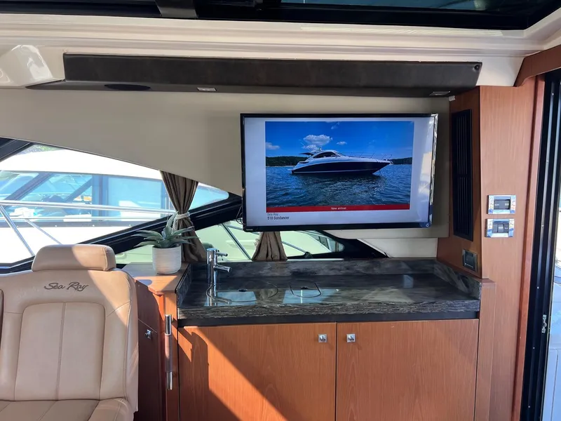 Slide: The Image of Luxurious interior of 2014 Sea Ray 510 Sundancer yacht with TV and sink. - 22