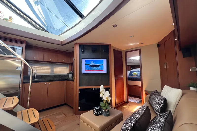 Slide: The Image of Luxurious interior of 2014 Sea Ray 510 Sundancer yacht with modern amenities and skylight. - 32