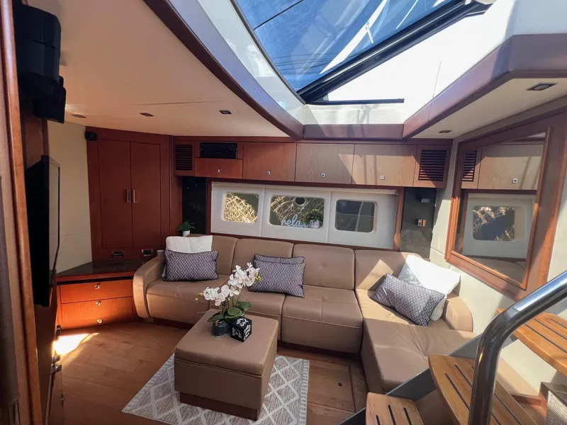 Slide: The Image of Luxurious interior of 2014 Sea Ray 510 Sundancer yacht with plush seating and skylight. - 33