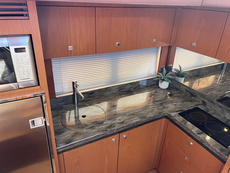 Slide: The Image of Luxurious kitchen interior of 2014 Sea Ray 510 Sundancer yacht with modern appliances. - 38