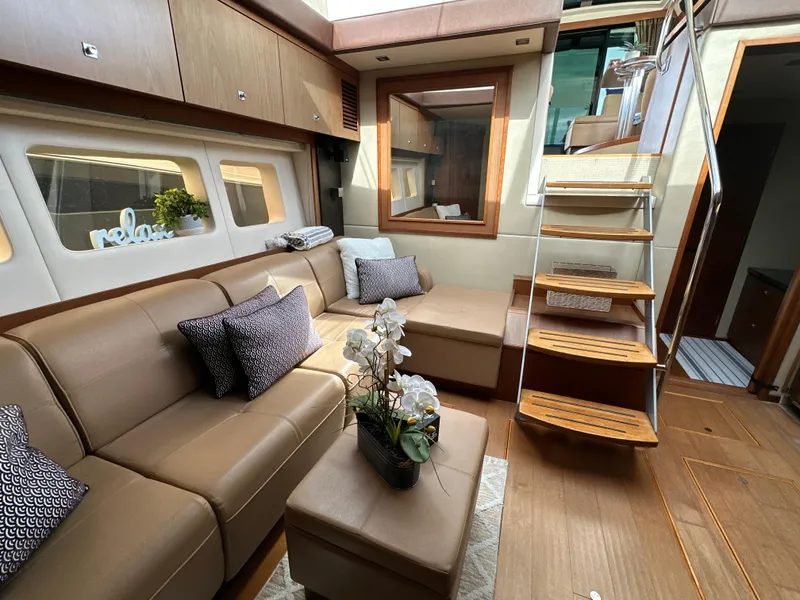 Slide: The Image of Luxurious interior of 2014 Sea Ray 510 Sundancer yacht with elegant seating and wooden stairs. - 40