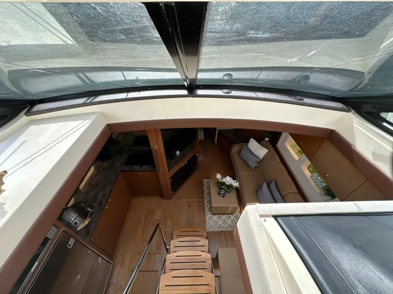 Slide: The Image of Interior view of 2014 Sea Ray 510 Sundancer yacht, featuring luxurious seating and modern design. - 44