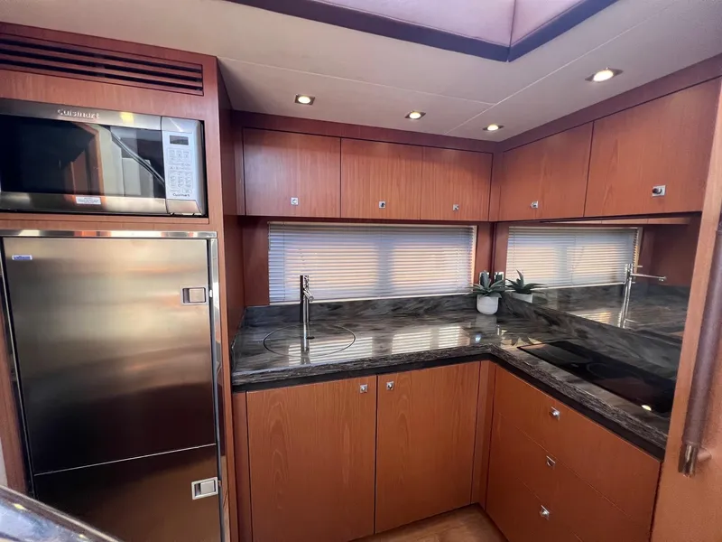 Slide: The Image of Luxurious kitchen interior of 2014 Sea Ray 510 Sundancer yacht with modern appliances. - 49
