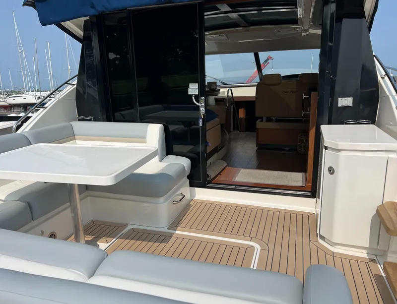 Slide: The Image of 2014 Sea Ray 510 Sundancer yacht with spacious deck and luxurious interior. - 5
