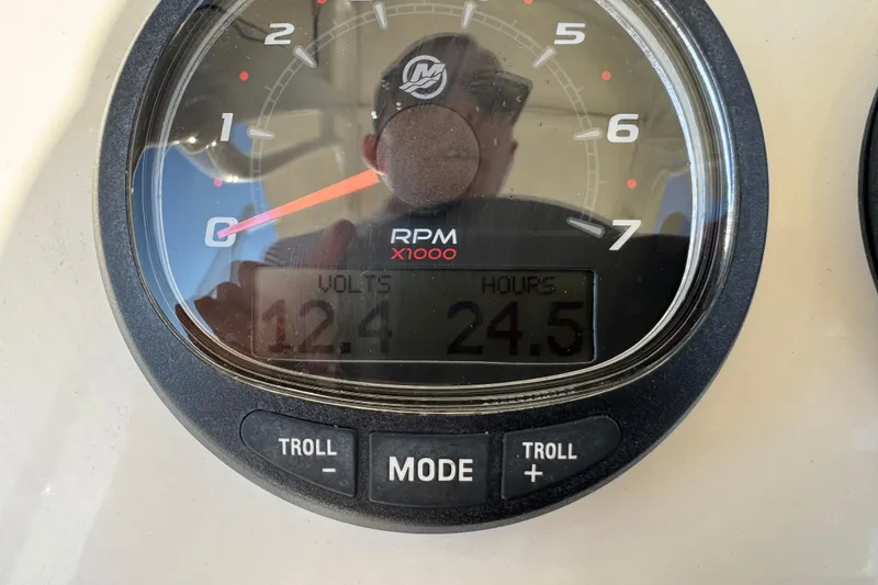 Slide: The Image of 2024 Scout 231 XSB boat gauge displaying RPM, volts, and hours. - 24