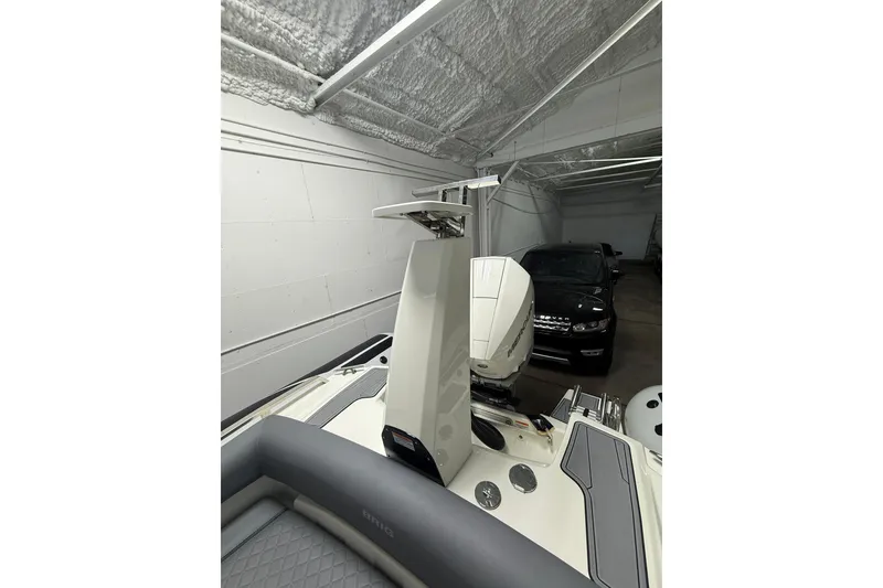 Slide: The Image of 2026 Brig Eagle 8 boat in garage, featuring modern design and powerful engine. - 16