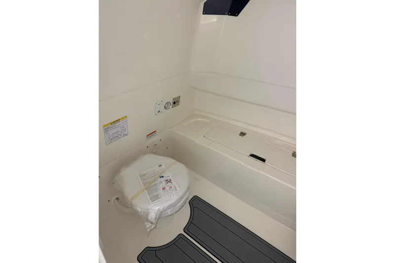 Slide: The Image of 2026 Brig Eagle 8 boat interior with storage compartment and safety equipment. - 25