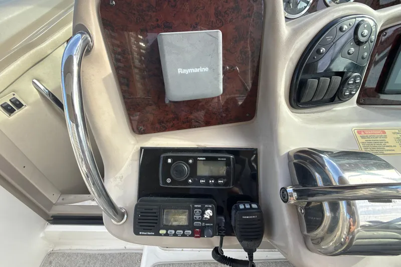 Slide: The Image of Control panel of a 2002 Sea Ray 320 Sundancer with Raymarine equipment. - 12