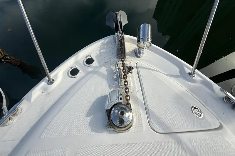 Slide: The Image of Bow of 2002 Sea Ray 320 Sundancer with anchor chain and deck details. - 17