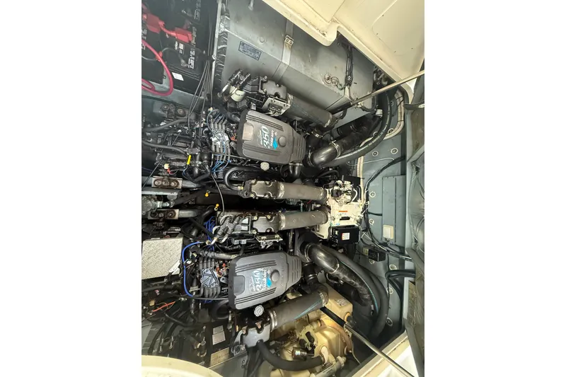Slide: The Image of Engine compartment of a 2002 Sea Ray 320 Sundancer boat, showcasing dual engines. - 25