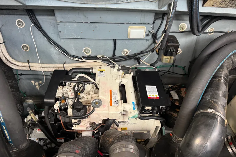 Slide: The Image of Engine compartment of a 2002 Sea Ray 320 Sundancer with Kohler power system. - 27