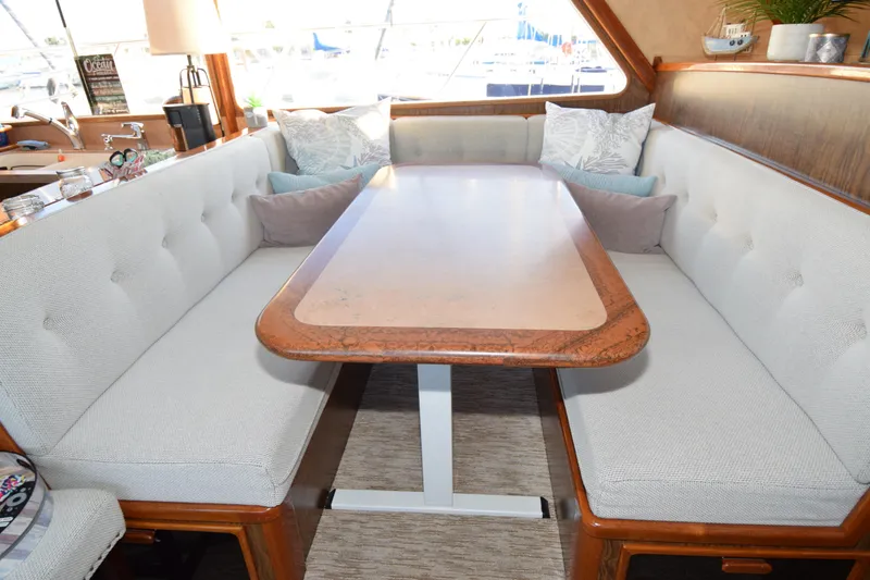 Slide: The Image of Luxurious 1966 Drake 53 yacht interior with elegant dining area and plush seating. - 13