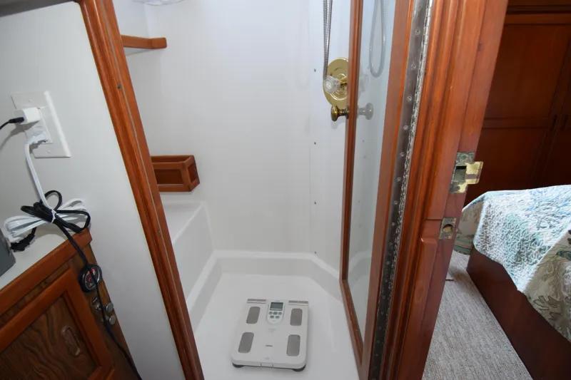 Slide: The Image of Shower area in 1966 Drake 53 boat with digital scale on floor. - 18