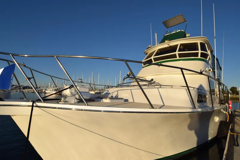Slide: The Image of 1966 Drake 53 yacht docked under clear blue sky. - 20