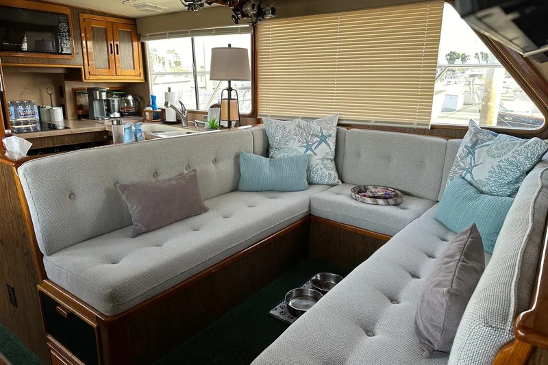 Slide: The Image of Interior of a 1966 Drake 53 yacht with cozy seating and nautical decor. - 25