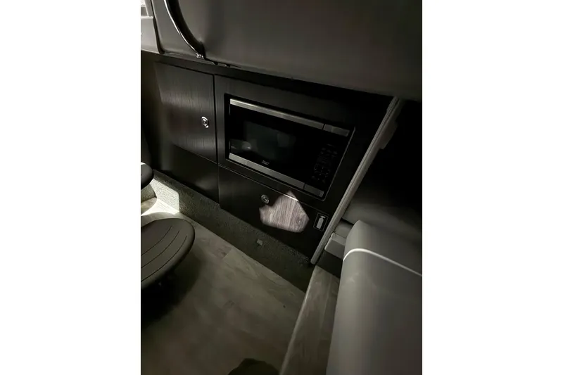 Slide: The Image of 2023 Formula 330 Crossover Bowrider I/O interior with built-in microwave. - 12