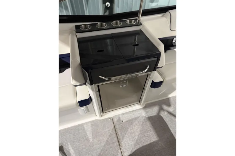 Slide: The Image of 2023 Formula 330 Crossover Bowrider I/O interior with sleek kitchenette and cup holders. - 18