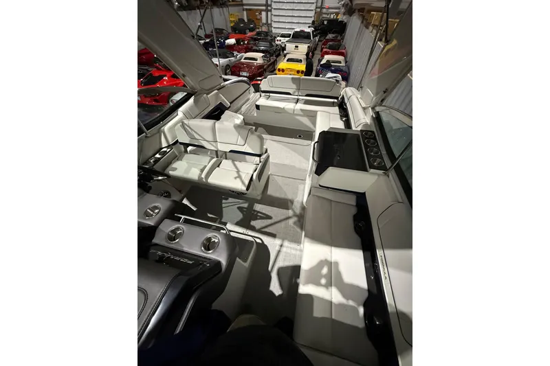 Slide: The Image of 2023 Formula 330 Crossover Bowrider I/O interior with seating and control panel. - 9