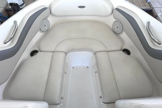 Slide: The Image of 2007 Chaparral 190 SSi boat interior with white cushioned seating and cup holders. - 10