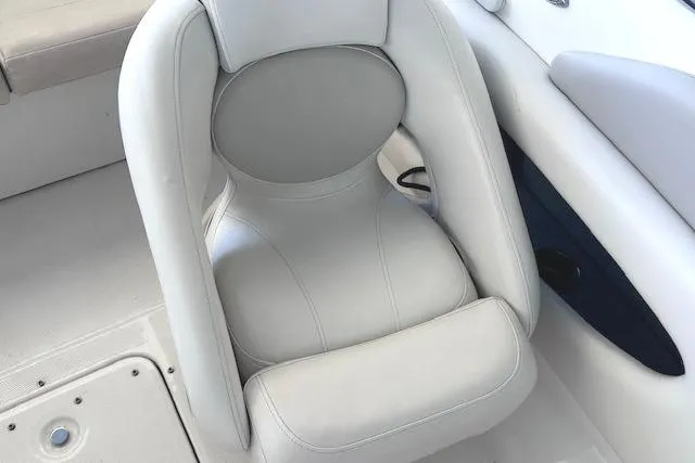 Slide: The Image of White leather seat on 2007 Chaparral 190 SSi boat interior. - 13