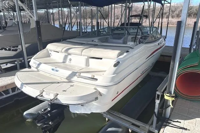 Slide: The Image of 2007 Chaparral 190 SSi boat docked in a marina, rear view. - 3