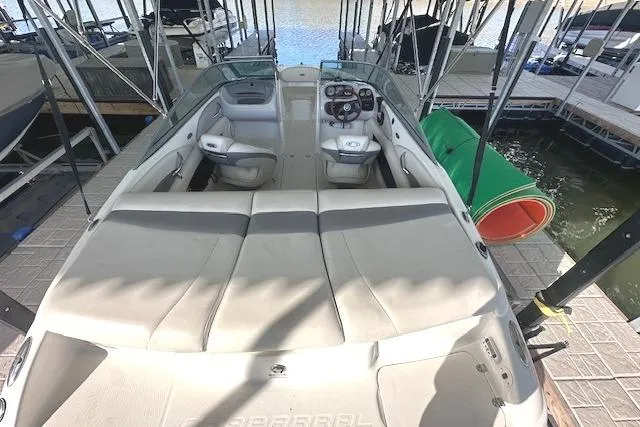 Slide: The Image of 2007 Chaparral 190 SSi boat interior with seating and dashboard, docked at marina. - 6