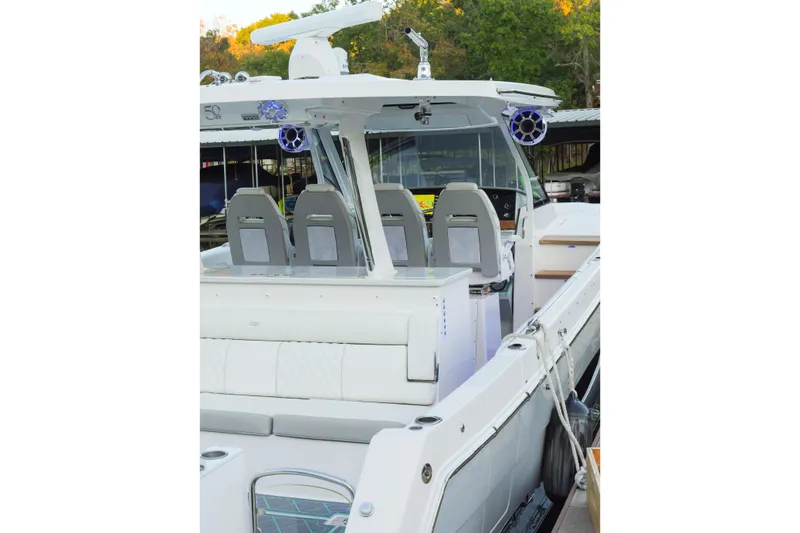 Slide: The Image of 2021 Regal 38 SAV boat interior with modern seating and advanced navigation equipment. - 11