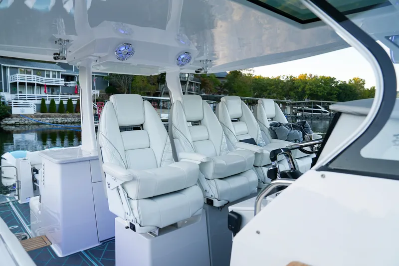 Slide: The Image of 2021 Regal 38 SAV boat interior with luxurious white seating and modern design. - 13