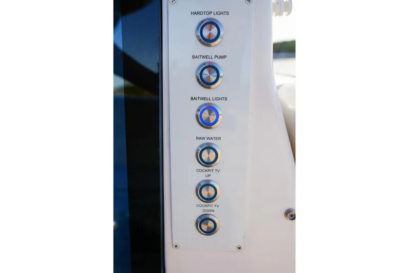 Slide: The Image of Control panel on 2021 Regal 38 SAV boat with labeled buttons for various functions. - 17
