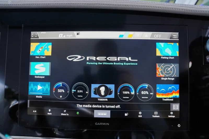 Slide: The Image of Dashboard display of 2021 Regal 38 SAV boat with navigation and system controls. - 18